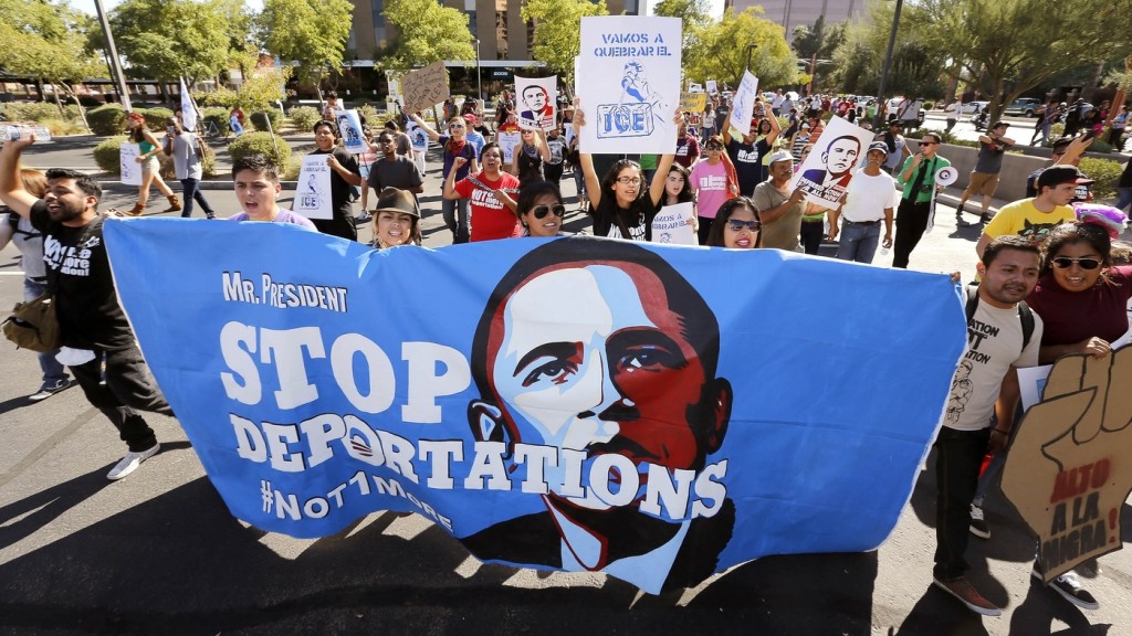 Hundreds protest President Obama's immigration policy, marching to the U.S. Immigration and Customs Enforcement office in Phoenix in 2013. Many Latinos who supported the president have become frustrated by his administration.